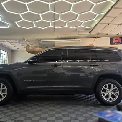 Grand Cherokee L with fresh tint under hex shop lighting in the Cañon City bay